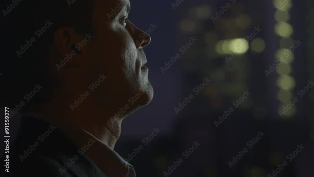 Man is Smoking Electronic Cigarette at Evening Man is Smoking Electronic Cigarette at Evening