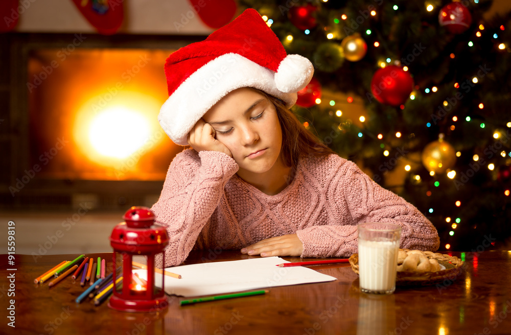 cute girl fell asleep while writing letter to Santa cute girl fell asleep while writing letter to Santa