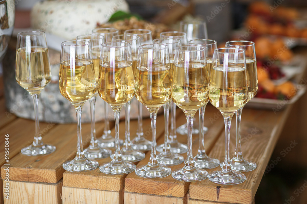 Glasses with champagne on the party table Glasses with champagne on the party table