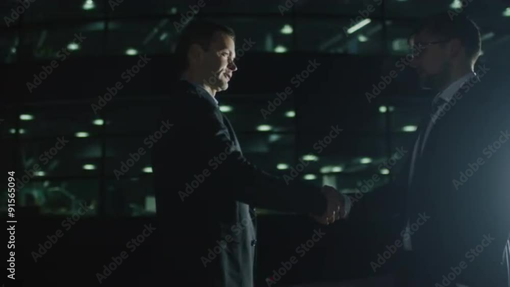 Handshake Between Two Businessmen at Evening 2 Handshake Between Two Businessmen at Evening 2