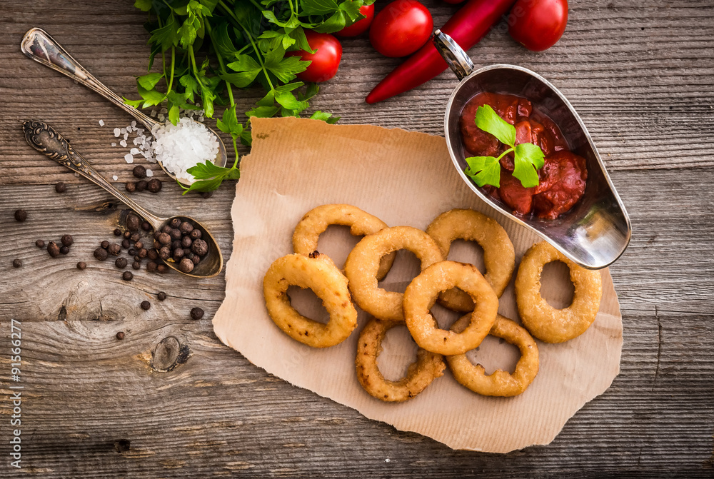 fried onion rings with vegetables and spices fried onion rings with vegetables and spices