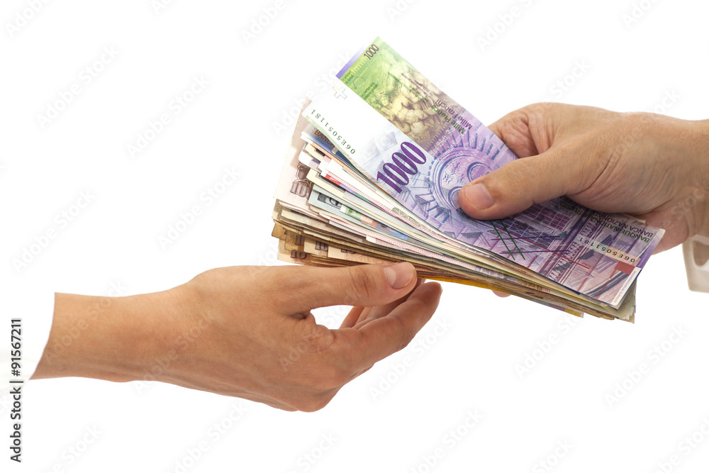 Hands giving money International currencies away Hands giving money International currencies away