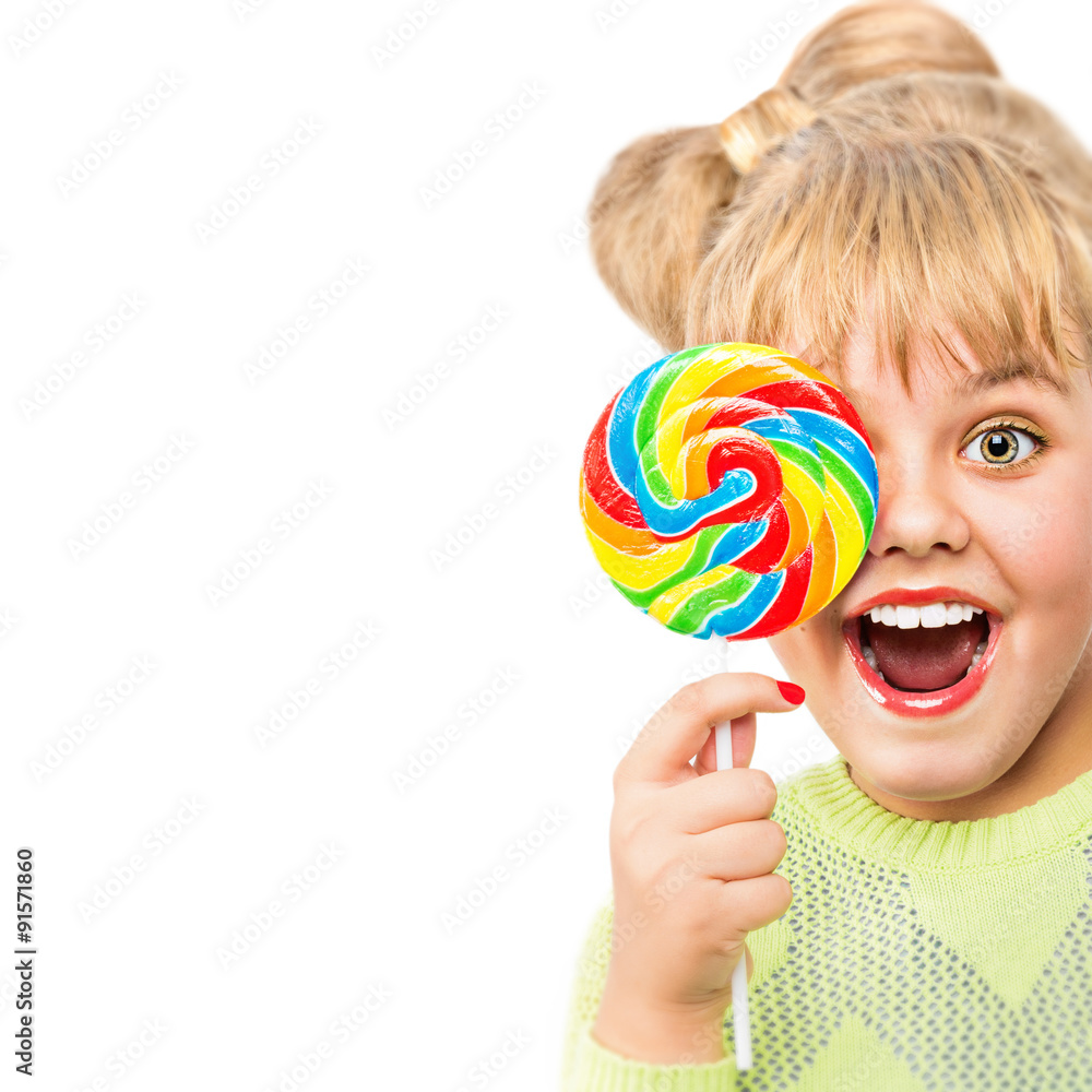 Portrait of a cheerful girl with candy on a white background.