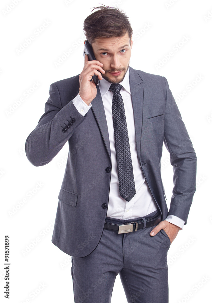 Cool businessman talking on mobile phone Cool businessman talking on mobile phone