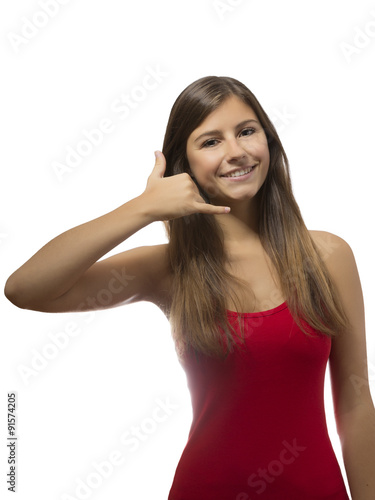 beautiful teenage girl portrait gesturing telephone sign © drmonochrome