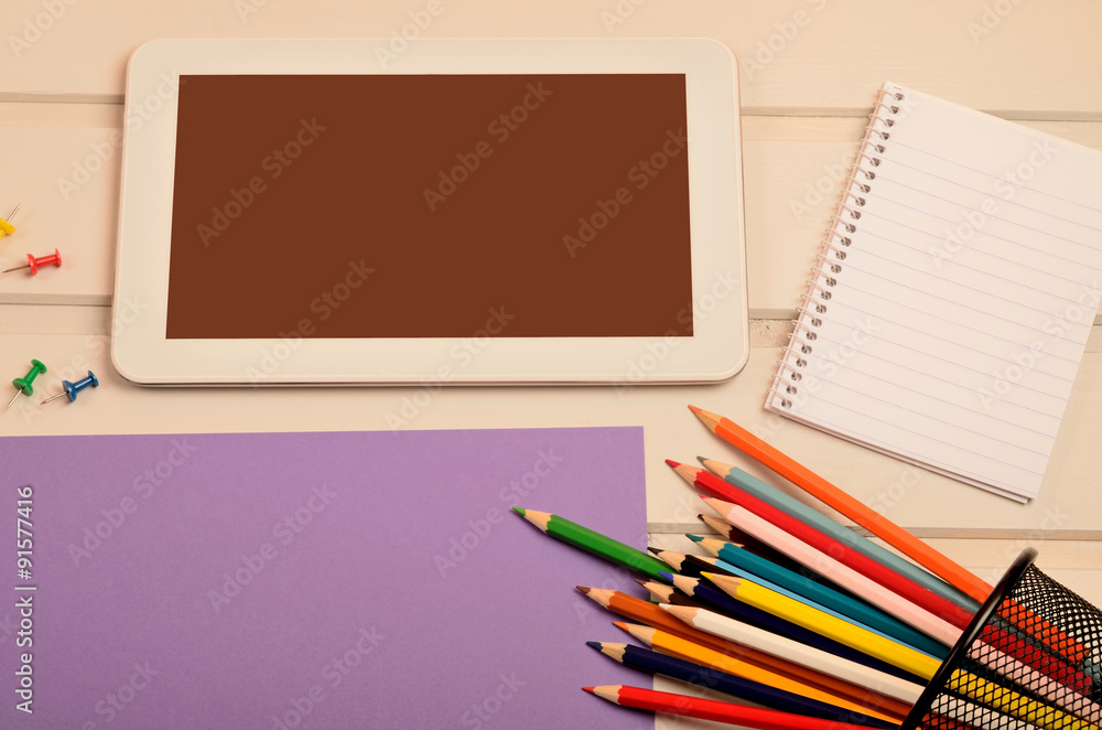Tablet with paper and colorful pencil Tablet with paper and colorful pencil