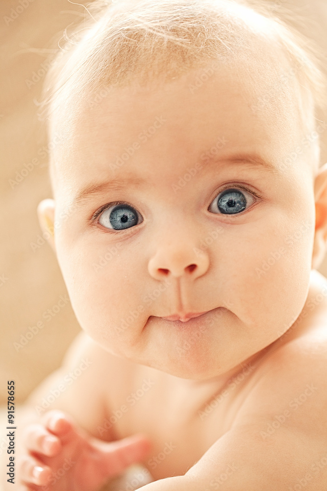 Portrait of small cute girl with blue eyes in her cozy white bed. Portrait of small cute girl with blue eyes in her cozy white bed.