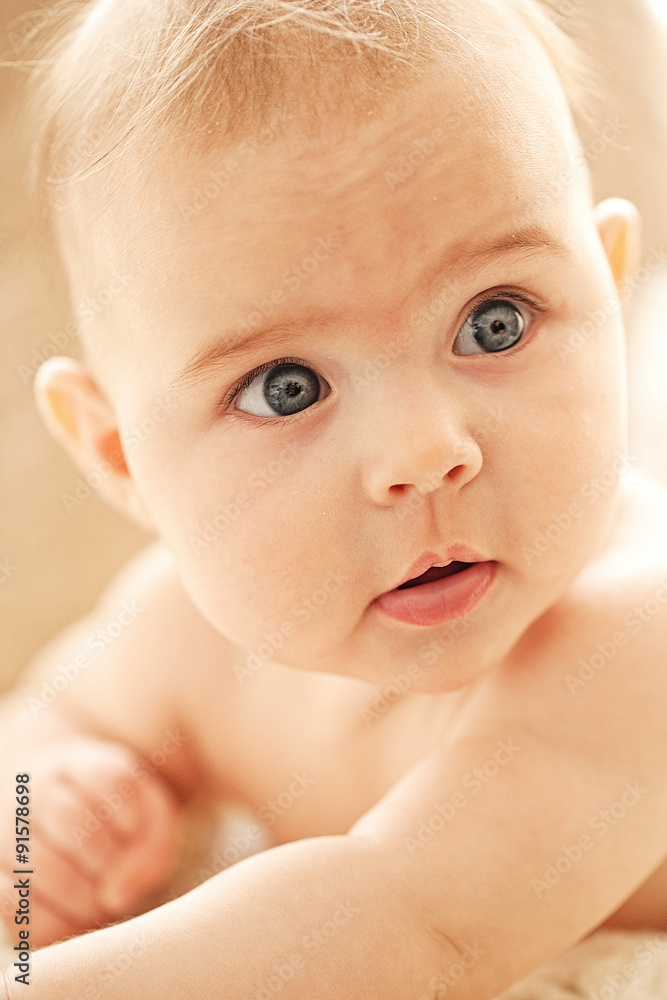 Portrait of small cute girl with blue eyes in her cozy white bed. Portrait of small cute girl with blue eyes in her cozy white bed.
