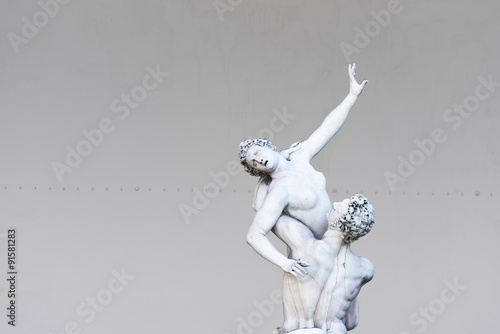 The Rape of Sabina women sculpture, in the Loggia dei Lanzin, Piazza della Signoria, Florence,Italy. photo