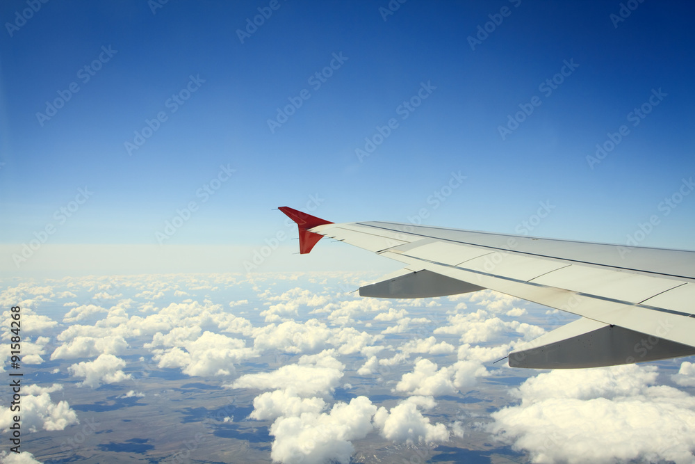 Fototapeta premium Wing of airplane from window