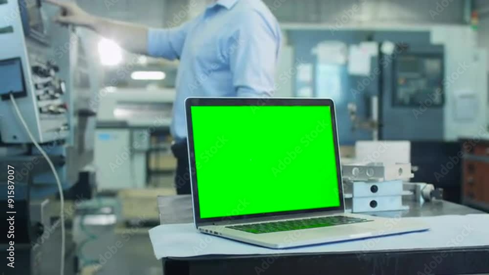 Notebook with Green Screen in Industrial Environment Mock-up