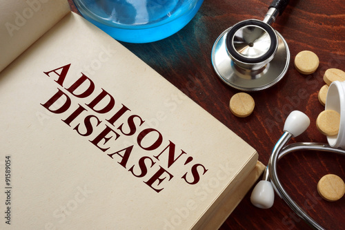 Addisons disease  written on book with tablets. Medicine concept. photo
