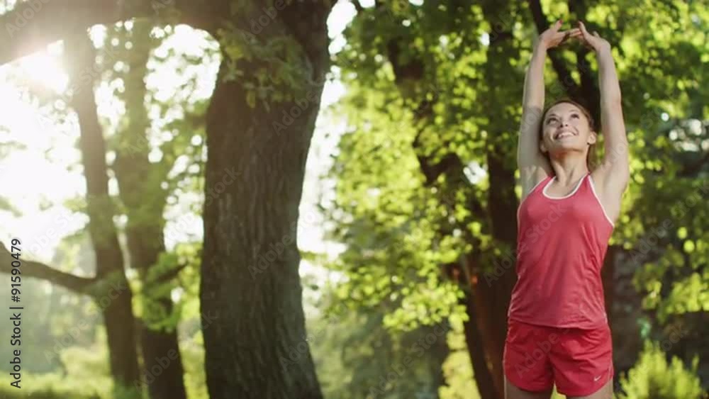 Pretty Girl Stops for Stretching during Run in Park. Jib Shot. Pretty Girl Stops for Stretching during Run in Park. Jib Shot.