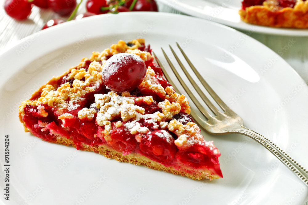 Tasty homemade pie with cherries on table close up Tasty homemade pie with cherries on table close up