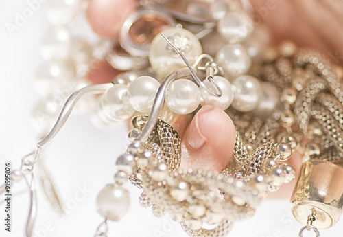 Jewelry on hand on a white background.