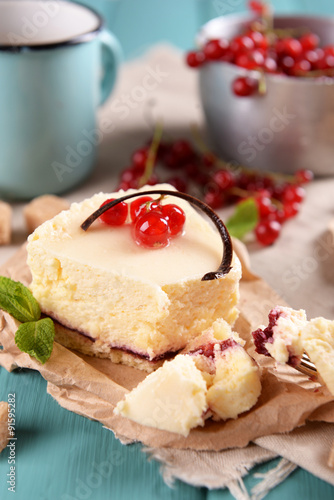 Tasty cheesecake with berries on table close up