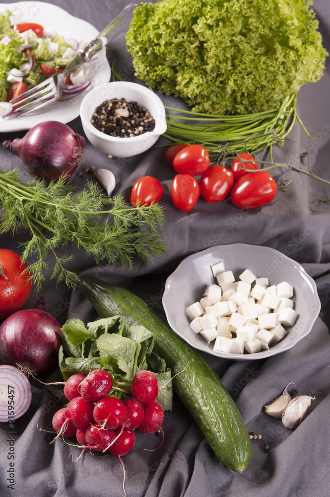 group of vegetables and cottage cheese, salad ingredients on a dark background 