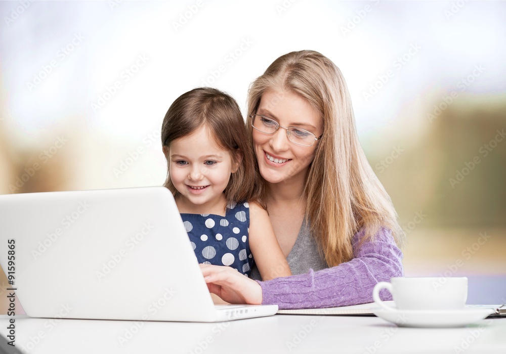At computer with mother. At computer with mother.