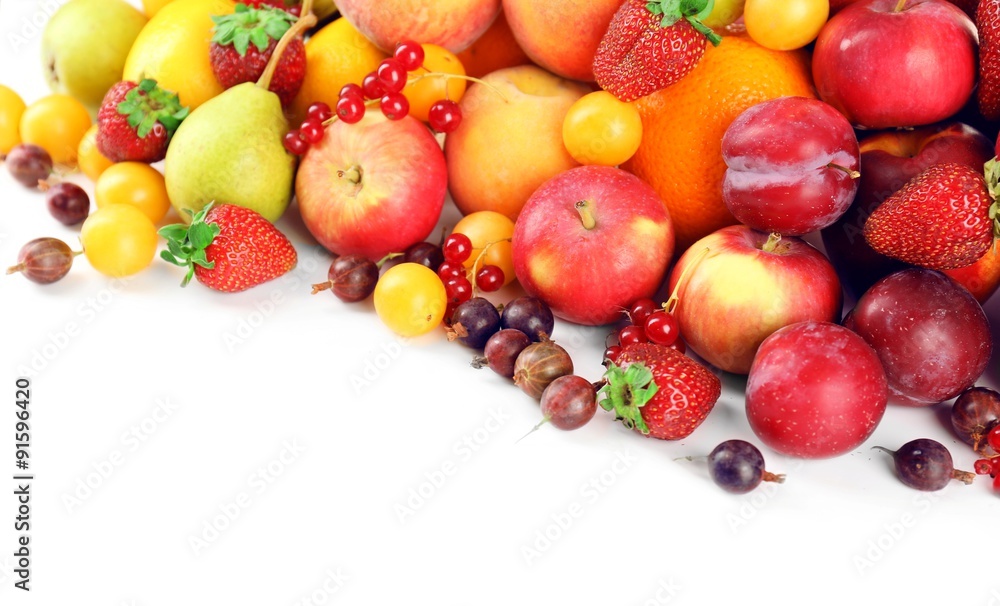 Heap of fresh fruits and berries  isolated on white