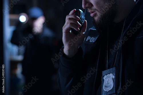 Canvas Print Officer using walkie talkie
