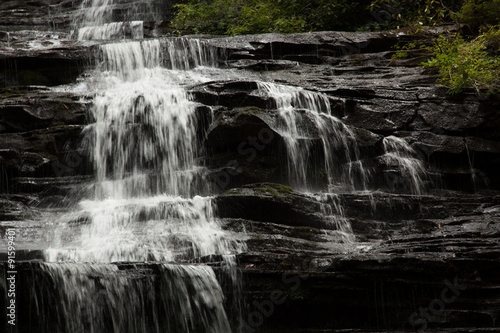 Mountain waterfall tumbling over rocks