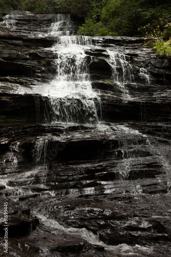 Mountain waterfall tumbling over rocks