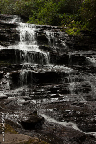 Mountain waterfall tumbling over rocks