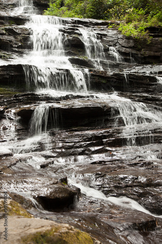 Mountain waterfall tumbling over rocks