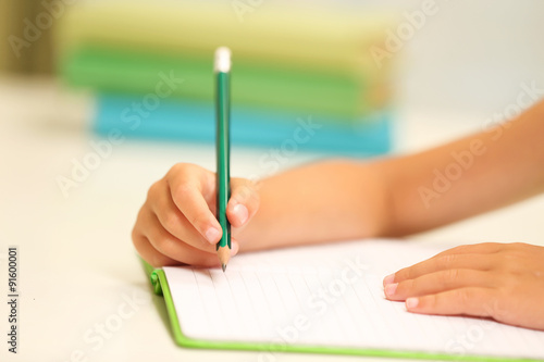 Cute girl at workplace in classroom