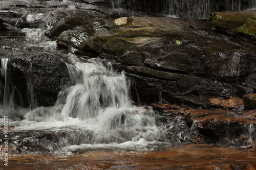 Mountain waterfall tumbling over rocks