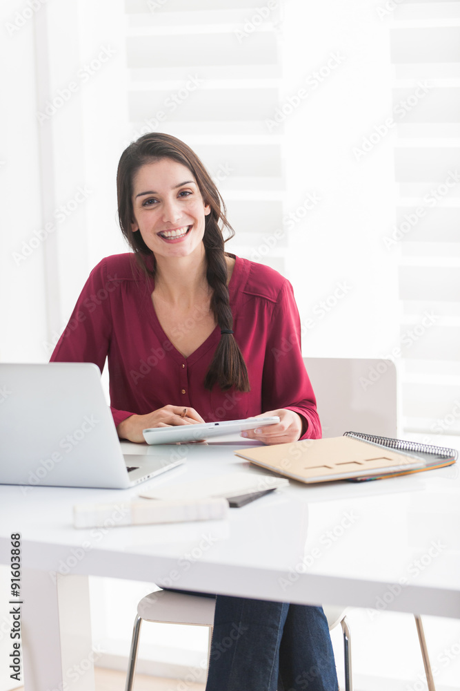Portrait of a smiling dark braided hair woman looking at camera Portrait of a smiling dark braided hair woman looking at camera