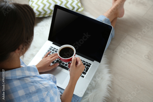 Woman working with laptop at home