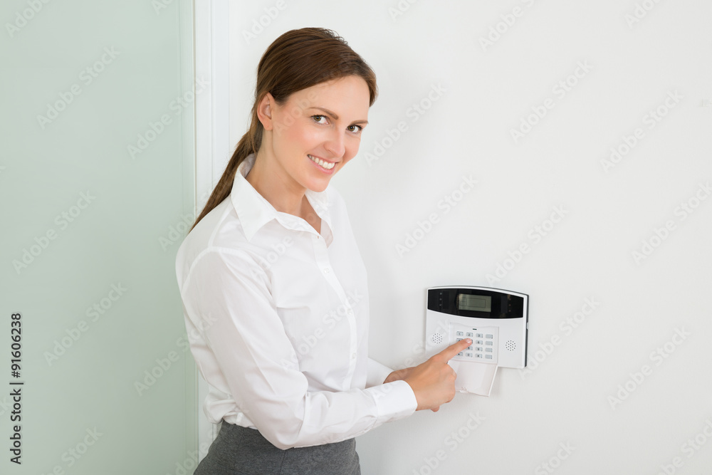 Businesswoman Enter Code In Security System