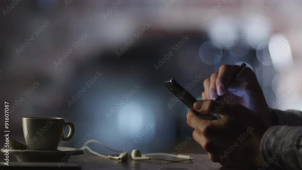 Using Mobile Phone with Stylus in Coffee Shop Using Mobile Phone with Stylus in Coffee Shop