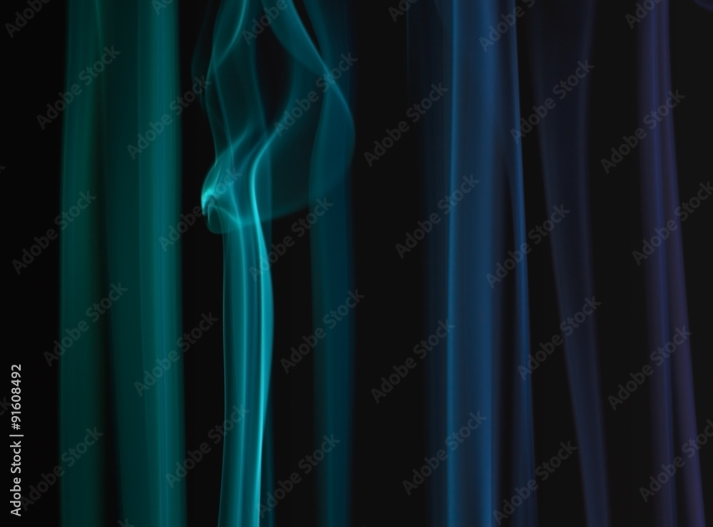 Abstract colored floating smoke on dark background Abstract colored floating smoke on dark background