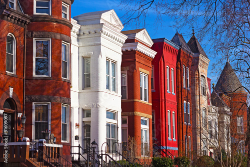 Row houses of Mount Vernon Square in Washington DC. Colorful residential townhouses in the afternoon sun.