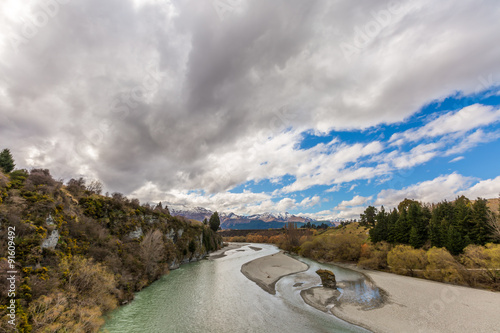Shotover RIver, New Zealand and cloudy background