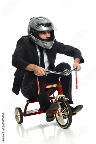 Vászonkép Young Businessman on Tricycle
