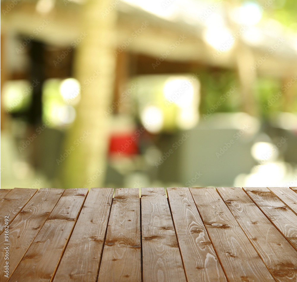 Wooden table with abstract blur background Wooden table with abstract blur background