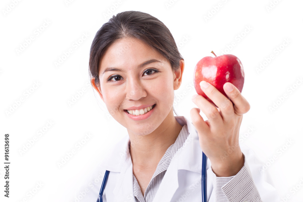 female doctor with hand holding red apple, concept of healthy fo female doctor with hand holding red apple, concept of healthy fo