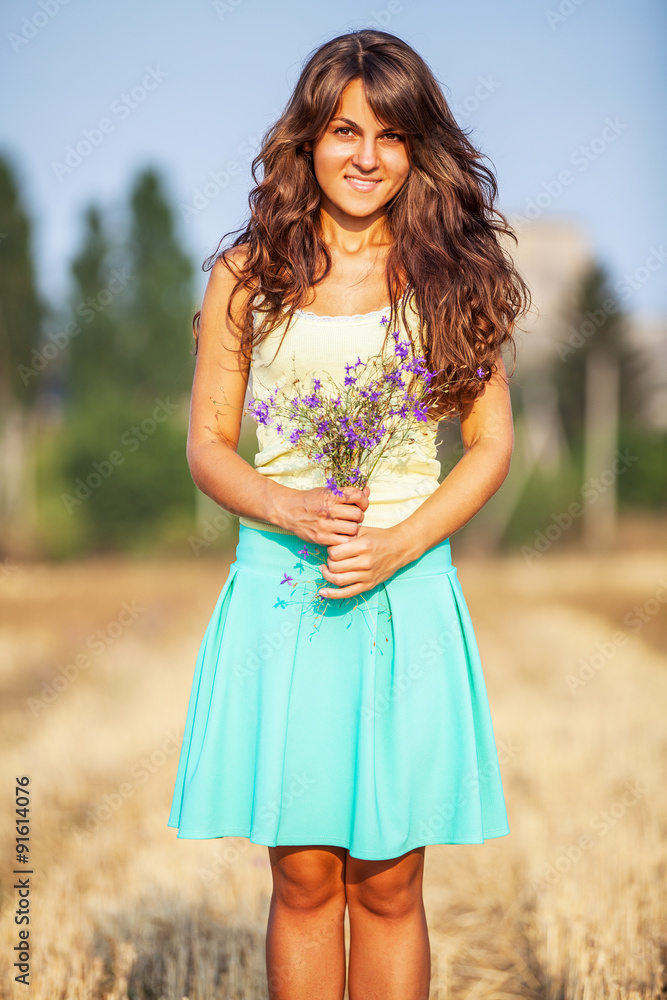 a girl stands in the field a girl stands in the field
