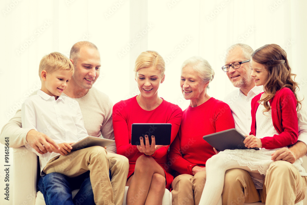 smiling family with tablet pc computers at home smiling family with tablet pc computers at home