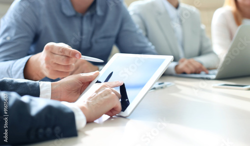 Photography Business adviser analyzing financial figures denoting the progress