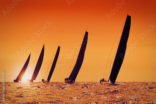 sailing yachts at sunset on the sea