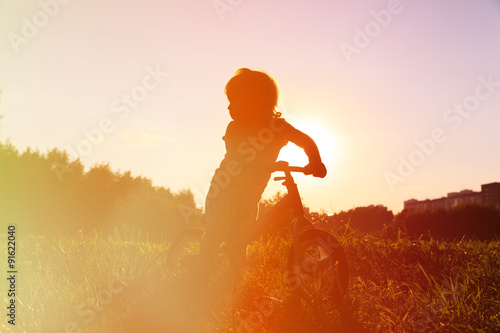 little girl riding bike at sunset, active kids