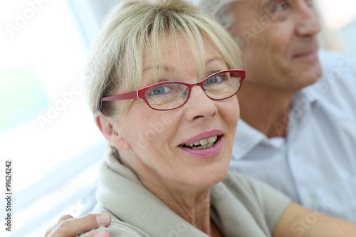 Portrait of happy senior woman with eyeglasses