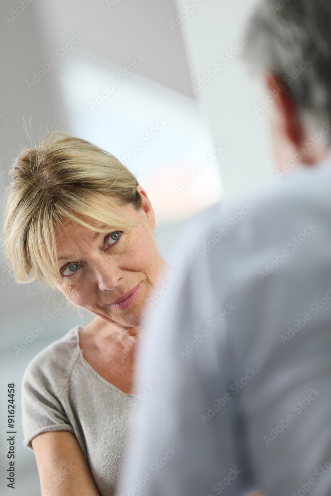 Senior woman attending group therapy Senior woman attending group therapy