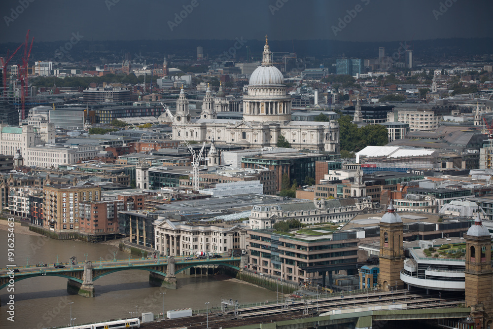LONDON, UK - SEPTEMBER 17, 2015: London panorama. St. Paul's cathedral against of raining dark sky