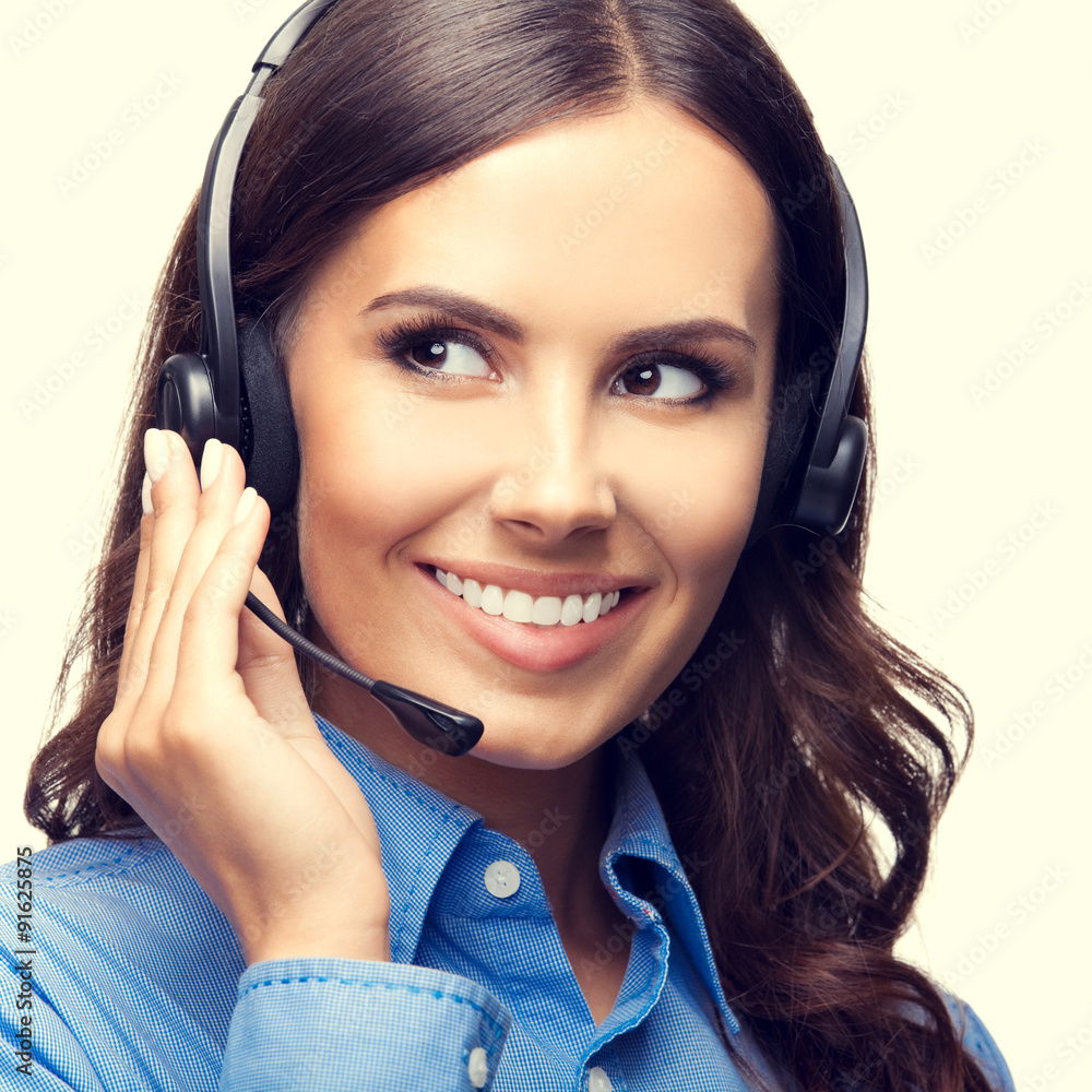 Portrait of happy smiling customer support phone operator Portrait of happy smiling customer support phone operator