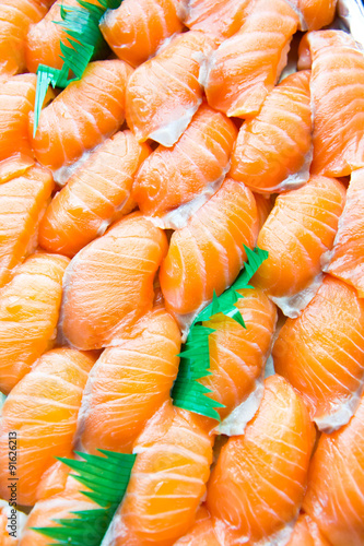 Row of shushi fresh shrimp and salmon